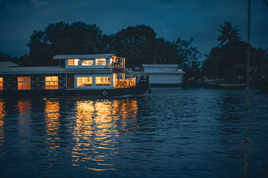 A modern two-story houseboat size shown on calm waters, highlighting space and design for comfortable living and cruising.